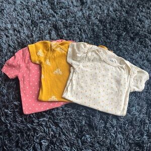 Set of Three Baby Onesies in Pink, Yellow, and Cream